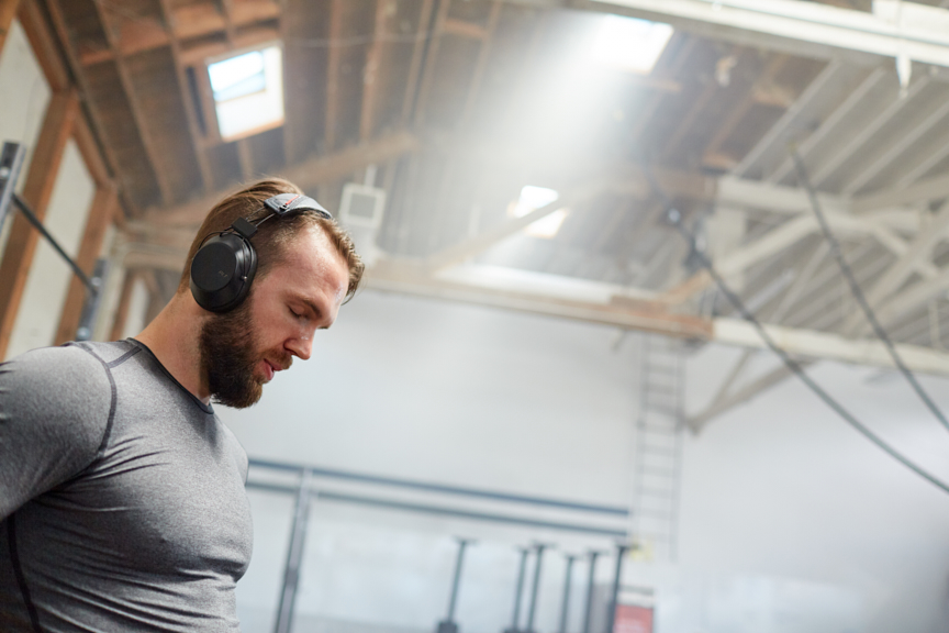 Man at Gym with BackBeat FIT 6100 Workout Headphones