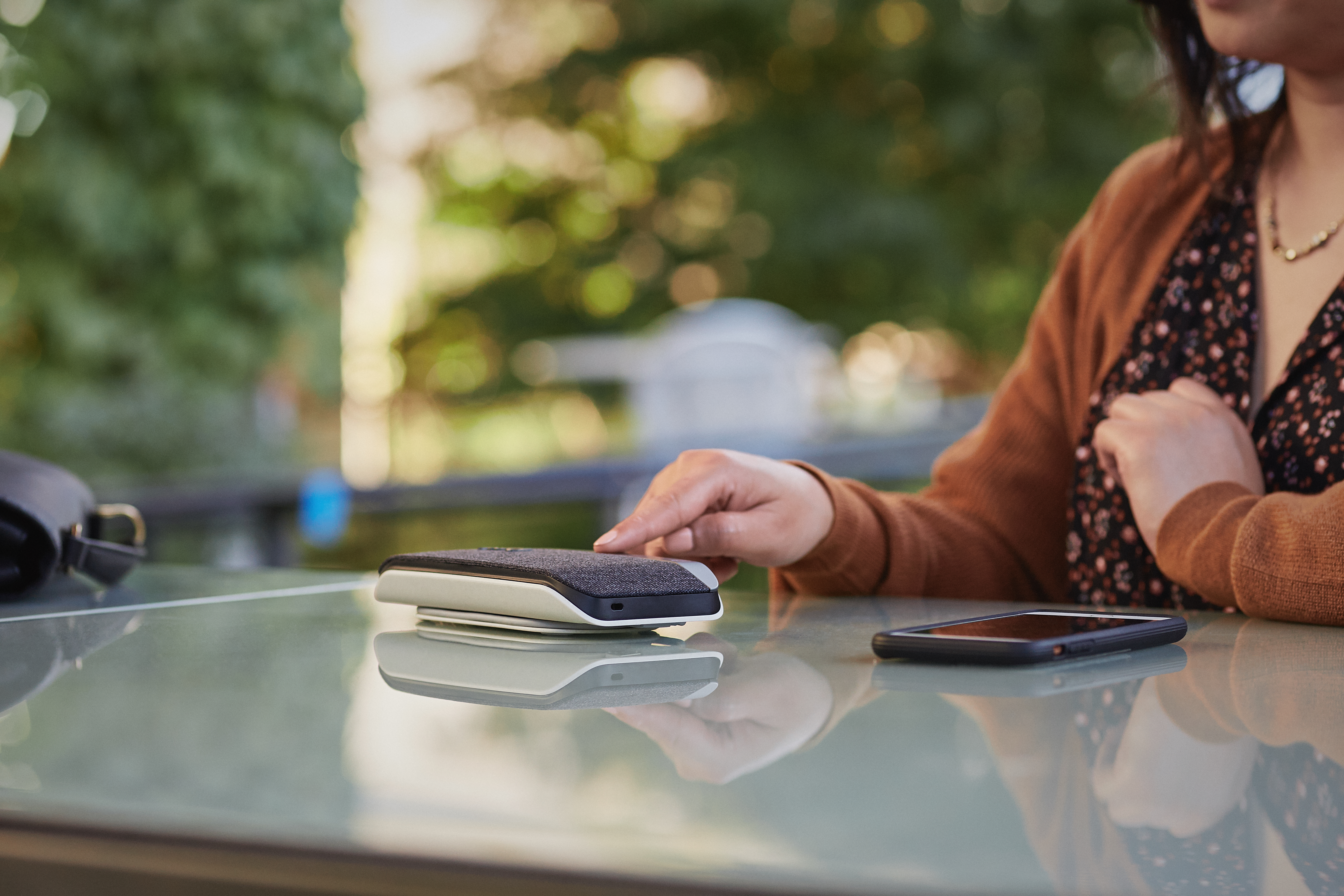 woman using Poly sync 20 outside